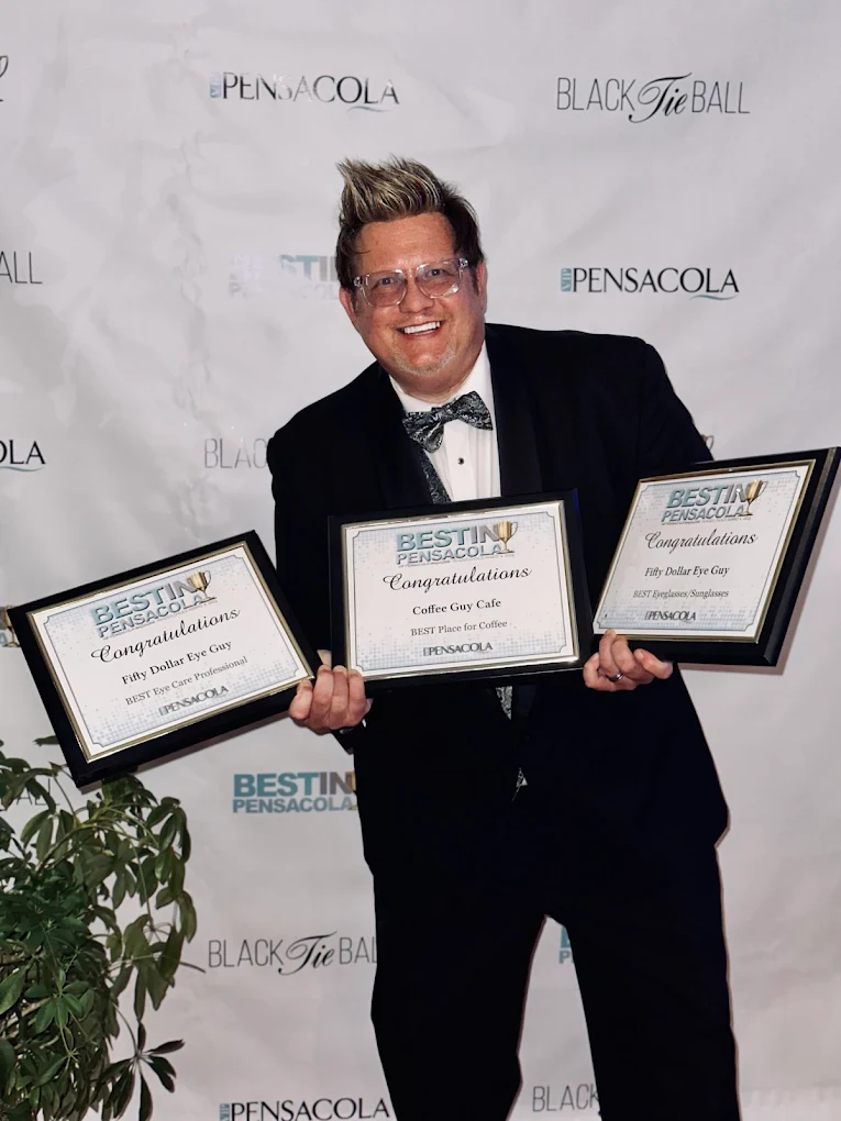 Voted Best in Pensacola — three VIP Reader's Choice award plaques for eye care and coffee