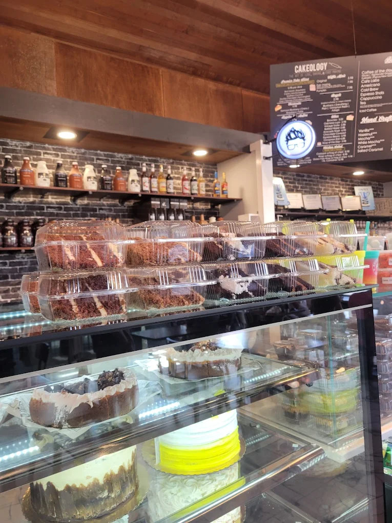Fresh coffee and cake display at Coffee Guy Underground, Pensacola